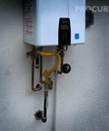 Installed water heater with connected pipes showing Half Inch FIP Female NPT Brass Ball Valve Full Port 600 WOG Beefy Built To Last