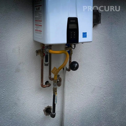 One Inch Flexible Stainless Steel Gas Connector With Sixty Inch Length Easy Install Three Quarter Inch MIP To Three Quarter Inch FIP Fittings With Or Without Service Valve Heavy Duty WP MaxFlow For Tankless Water Heater Blue A1 Series installed on outdoor tankless water heater.