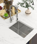 Overhead view of 15 x 17 Inch Undermount Bar Sink In 16 Gauge T304 Stainless Steel, Single Bowl Wet Prep Kitchen Sink on marble countertop.