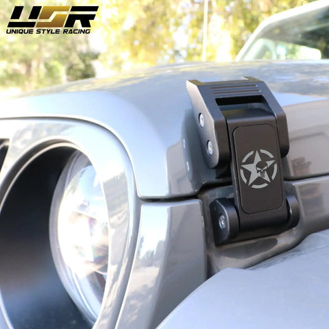 Close-up of Heavy Duty Skull Hood Latch Set For Jeep Wrangler JL 2018 To 2024 And Gladiator JT with skull design on a grey hood
