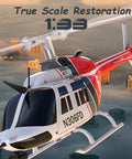 C138 Remote Control Helicopter One Thirty Three Scale Bell 206 Chopper flying over a cityscape with true scale restoration