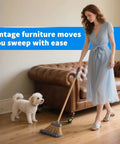 Woman sweeping floor next to sofa on Brass Vintage Ball Caster Wheels 2 Inch Heavy Duty TPR Casters with dog watching