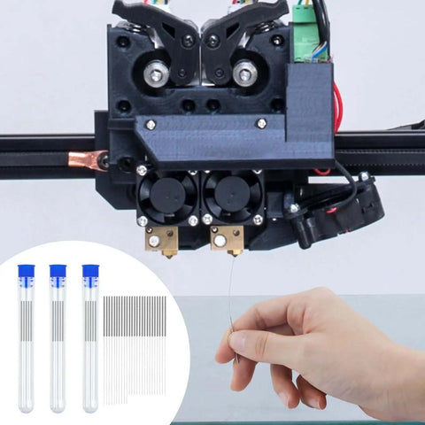 Hand using Essential 50 Piece 3D Printer Nozzle Cleaning Kit With 0.2mm 0.25mm 0.3mm 0.35mm 0.4mm stainless needles for maintenance