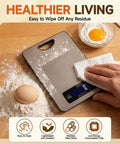 Digital Kitchen Scale With Lab Grade Precision, 11 Lb Capacity Stainless Steel Food Scale being wiped clean on wooden surface