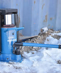 Heavy Duty Hydraulic Toe Jack Built Like A Tank For 30 Ton Heavy Lifting, blue jack on a snowy surface.