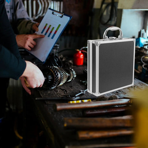 Black Aluminum Alloy Toolbox With Secure Lock And Lightweight Metal Handle Multi Function Parts Organizer Built Tough For The Daily Hustle And Sweet Setup For Quick Loadouts on a workshop table.