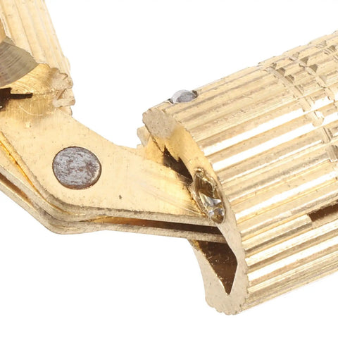 Smooth Operator Brass Concealed Barrel Hinges Six Piece Kit showing detailed brass hinge mechanism with grooves and screws.