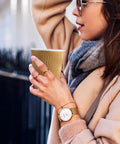 Woman holding No Sleeve Needed 12 Oz Ripple Wall Corrugated Insulated Paper Cup With Anti Scald Grip