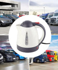 Heavy Duty 1000 Ml Car Kettle Built For Road Warriors Fast Boiling 24V Water Heater With Auto Shut Off Safety System Stainless Build Great For Truckers Getting A Darn Good Cup On Weekend Drives in parking lot with vehicles.