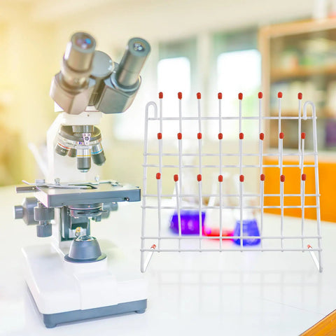 Compact Lab Glassware Drying Rack For Beakers And Flasks Lightweight Industrial Grade Design next to a microscope in a lab setting.