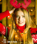 Woman wearing red antler headband with 2Pack 500LED Solar String Lights Outdoor Waterproof 180FT With 8 Modes IP65 Warm White Twinkle