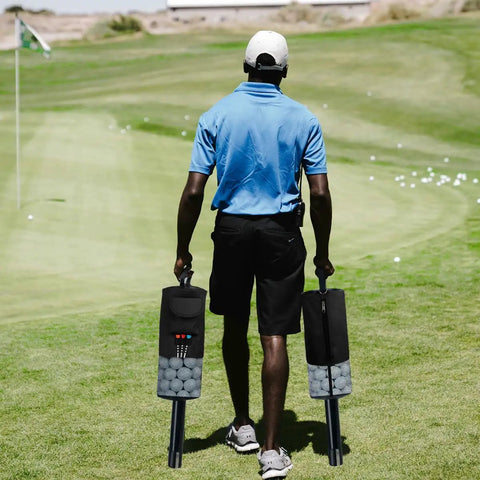 Person carrying two Portable Golf Ball Retriever Shag Bags With Removable Plastic Tube on a golf course, each holding 60 balls.