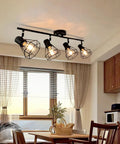 4 Light Track Lighting Fixture In Black Industrial Style With Open Wire Cage installed in dining room, E26 base, bulbs not included.