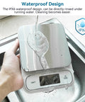 Waterproof IPX6 Kitchen Scale with backlit display, stainless steel platform being rinsed, ultra precise 0.1 g and 0.01 oz.