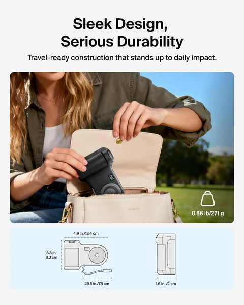 Person placing Magnetic Wireless Camera Grip Power Bank 9300mAh with Retractable USB C Cable into a bag outdoors.