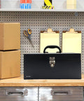 Black 16 inch portable metal toolbox built to last, 18 gauge steel with locking latch, heavy duty drawer organizer tackle box on a workbench.