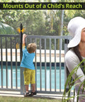 Straight Up Tough Top Pull Pool Safety Gate Latch With Audible Alarm Feature Keeps Kiddos Secure While Giving Homeowners Zero Hassle Installation And Weatherproof Year Round Guarding Black mounted high out of child's reach near pool.