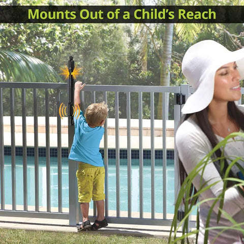 Straight Up Tough Top Pull Pool Safety Gate Latch With Audible Alarm Feature Keeps Kiddos Secure While Giving Homeowners Zero Hassle Installation And Weatherproof Year Round Guarding Black mounted high out of child's reach near pool.