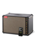 Spark Live Smart Guitar Amp With 4-Channel PA, Built-In Mixing, Effects, And App Control, Bluetooth Speaker next to phone