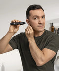 Man using Weed Whacker 2.0 Nose and Ear Hair Trimmer with 7000 RPM Motor for quick, clean trims, wet dry use, rechargeable battery.