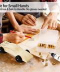 Pinewood Derby Weights Kit With Graphite Lubricant For Axles And Wheels Lead Free Copper Cylindrical Weights next to a wooden car