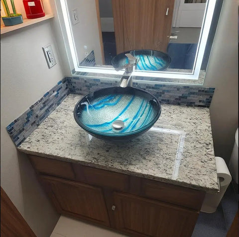 Bathroom vanity with Dope Teal Blue Crystal Glass And Gray Marble Mosaic Tile interlocking sheets backsplash, stone countertop.
