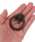 Hand holding one piece of Two Pack Vintage Drop Ring Drawer Pulls In Antique Bronze For Dresser Cabinets And Doors Retro Cabinet Knobs And Handles For Classic Furniture Hardware