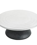Front view of MAOPINER 12-inch sculpting wheel with white top surface and black cast-iron base.
