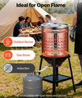 42 Quart Stainless Steel Stock Pot With Strainer, Lid And Handles used on open flame outdoors for large batch cooking.
