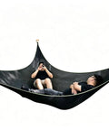 Two people relaxing on an Outdoor Triangular Hammock With Mesh Nylon, Portable 3 Point Design For Camping And Backyard Lounging