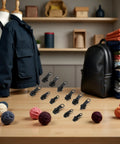 12 Piece Zipper Repair Kit With Replacement Sliders And Pulls For Jackets, Clothes And Backpacks on table with fabric and mannequin
