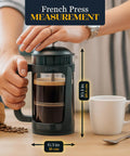 Grit-Free French Press Coffee Maker With Patented Double Micro-Filter, 32 Oz Capacity, Black Finish, on table with coffee cup