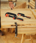 Two Piece Quick Release G Clamps Set For Woodworking With Plastic Jaw Bar Design Easy Trigger Mechanism on wooden workbench.