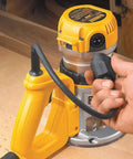 Close-up of Heavy Gauge 2 1/4 HP Wood Router With Electronic Variable Speed, showcasing cushioned D handle and power connection.