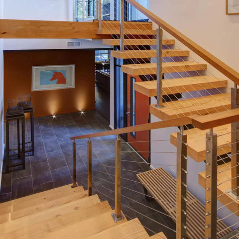 Modern indoor staircase with wood steps and metal railings using 1/8 Inch T316 Stainless Steel Wire Rope Cable 300 Ft For Deck Railing Kit Aircraft Grade 7x7 Construction Outdoor Coastal Ready Anti Oxidation And Corrosion Resistant DIY Balustrades With Cutter Included