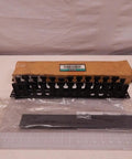 Horizontal Cable Manager 1U Black for Rack Mounts with Dual Hinged Cover and Flexible Fingers on table with packaging