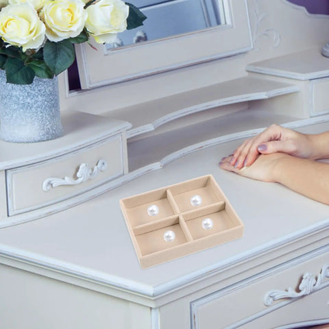 Beige Velvet Jewelry Display Tray With Four Grids And Sturdy Wooden Lid For Ring Bracelet Earring Storage Stackable Vanity Organizer on a dresser.