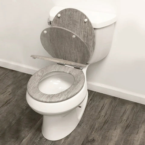 Distressed Grey Wood Round Toilet Seat With Chrome Hinges Durable Wood Veneer Construction Easy Install Securely Attaches To Most Toilets Soft Close Feature For Quiet Modern Bathroom Upgrade, installed on white toilet