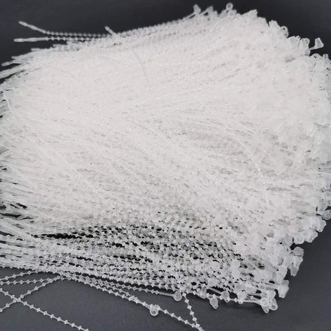 One Thousand Pack Of 5 Inch Adjustable Security Beaded Loop Ties With Snap Lock Pins Ideal For Retail Price Tags And Shipping Seals With Rock Solid Tamper Protection And Straight Up Effortless Hook Up Anywhere, clear plastic ties.