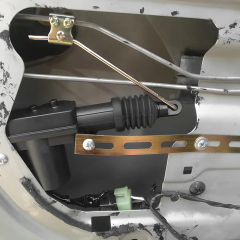 Close-up of 2 Pack Car Power Door Lock Actuators 12V 2 Wire Central Locking System Kit installed in vehicle door