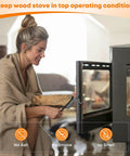 Wood stove gasket kit installation with a person placing a log into an open stove door