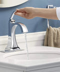 Ridgeport Single-Handle Lavatory Faucet For Modern Bathrooms in chrome finish with water flowing, easy one-turn control in action.