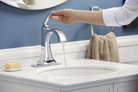 Ridgeport Single-Handle Lavatory Faucet For Modern Bathrooms in chrome finish with water flowing, easy one-turn control in action.