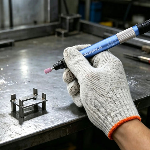 Top Shelf 1/8 Inch Pencil Air Die Grinder in hand, used for deburring and grinding on metal work.
