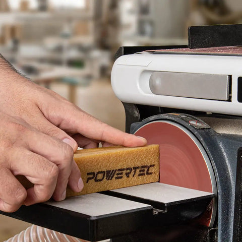 Hand using Two Pack Eight And A Half Inch Abrasive Cleaning Stick For Sanding Belts And Discs Natural Rubber Eraser on disc sander