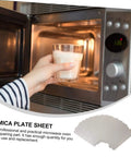 Open microwave with hand holding a cup, displaying 12 Piece Mica Plate Sheet Set For Microwave Waveguide Cover Replacement Parts Heat Resistant