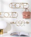 Sleek Wall Mounted Coat Rack Featuring Heavy Duty Gold Metal Hooks To Keep Your Daily Gear Locked Down While Bringing Major Street Style To Any Hallway Entryway Or Office Setup That Never Misses with pink bag and lamp.