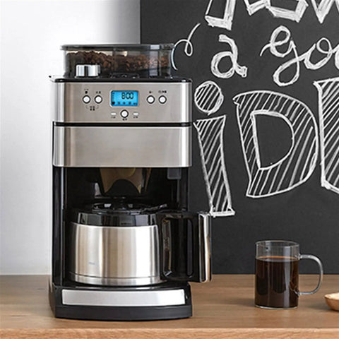 Fully Automatic Home Coffee Maker With Integrated Grinder And Guided Assisted Tamping crafted with a sleek stainless steel finish, brewing espresso.