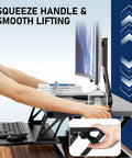 Side view of 32 Inch Standing Desk Converter With Dual Monitor Setup, showing squeeze handle for easy elevation, black