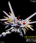 Mighty Strike Freedom Gundam HG 1/144 Model Kit From Gundam Seed Freedom in dynamic action pose with beam rifle.